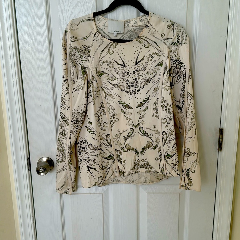 Gorgeous silk top - very slimming. Can wear for work or dress up for formal.